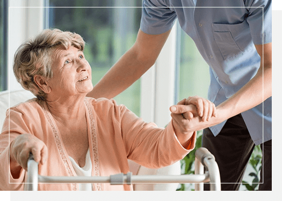 A woman holding the hand of another person.